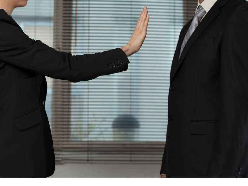 woman-trying-to-set-boundaries-by-using-her-hand-to-demonstrate