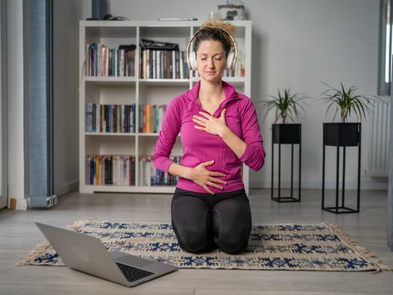 woman-meditating-while-on-short-break-as-self-care-practice-for-mothers