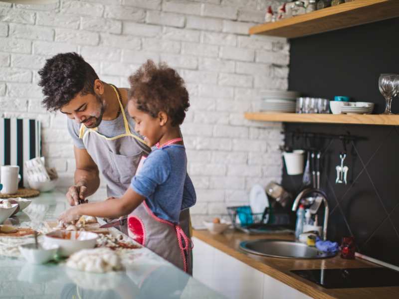 dad-with-son-in-the-kitchen-making-pizza