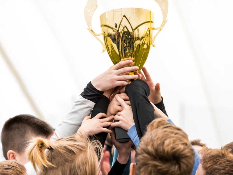 kids-celebrating-their-achievements-with-a-trophy-