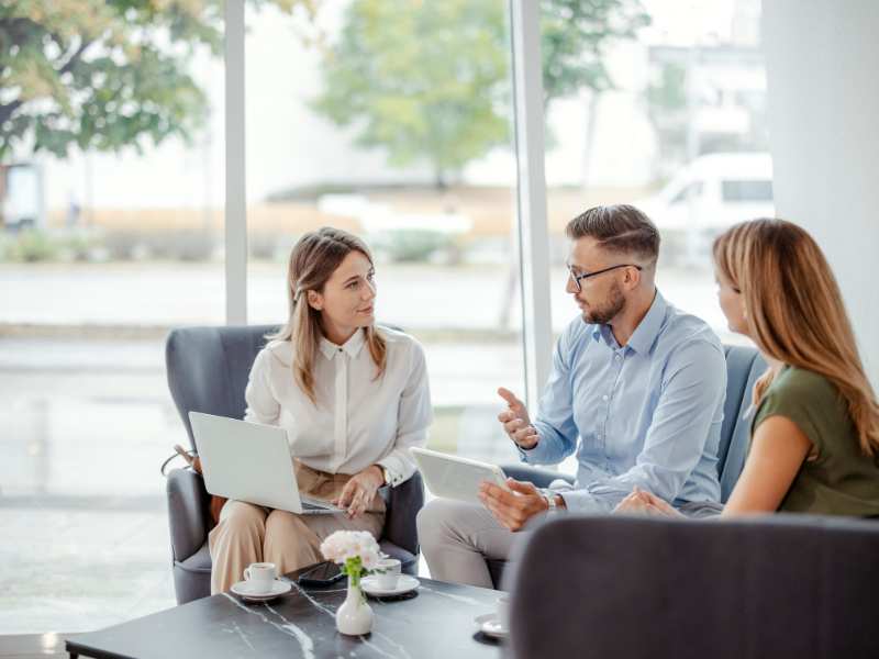 a-parent-discussing-with-professionals-by-the-table-in-a-room-on-how-to-discipline-and-care-for-special-child