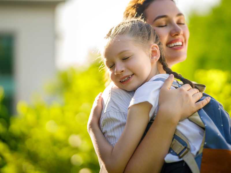 woman-and-daughter-with-back-pack-