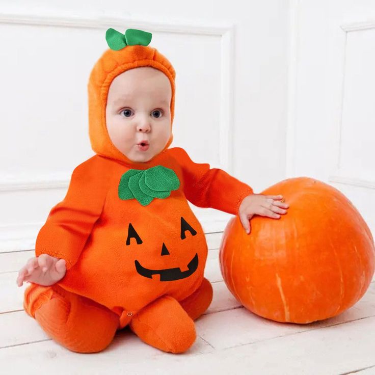 baby-on-little-pumpkin-costume-adorable-baby-first-Halloween-costume-idea