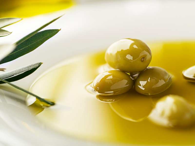 healthy-olive-oil-with-olives-ingredients-close-up