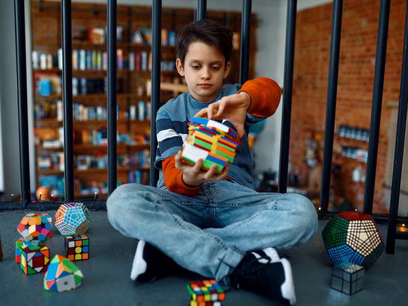 little-boy-trying-to-fix-puzzle