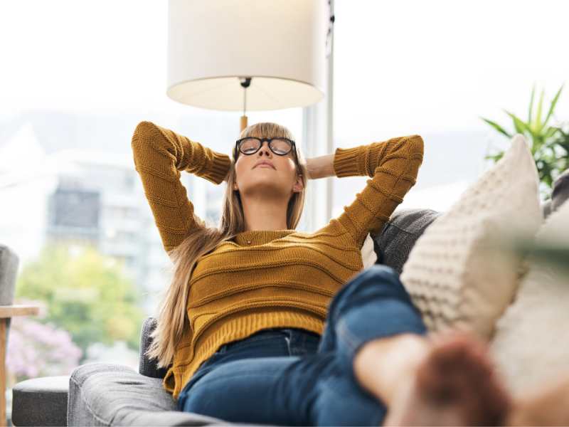 a-young-woman-relaxing-on-the-sofa-at-home