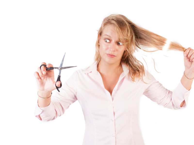 woman-trimming-her-hair