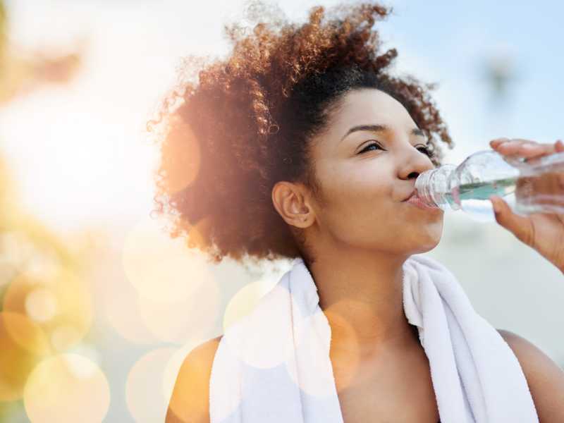 woman-drinking-water-to-stay-hydrated