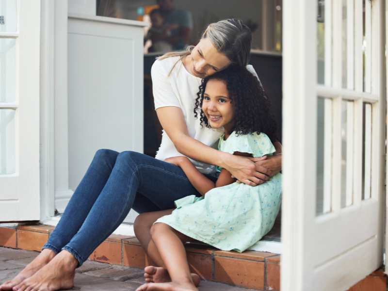 mom-embracing-little-girl-showing-emotional-support