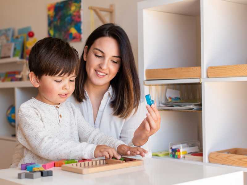 mom-homeschooling-child-playing-with-Tetris-wood-puzzle