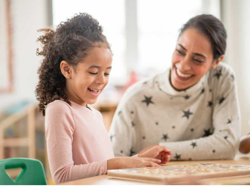 mom-and-daughter-solving-a-puzzle-together