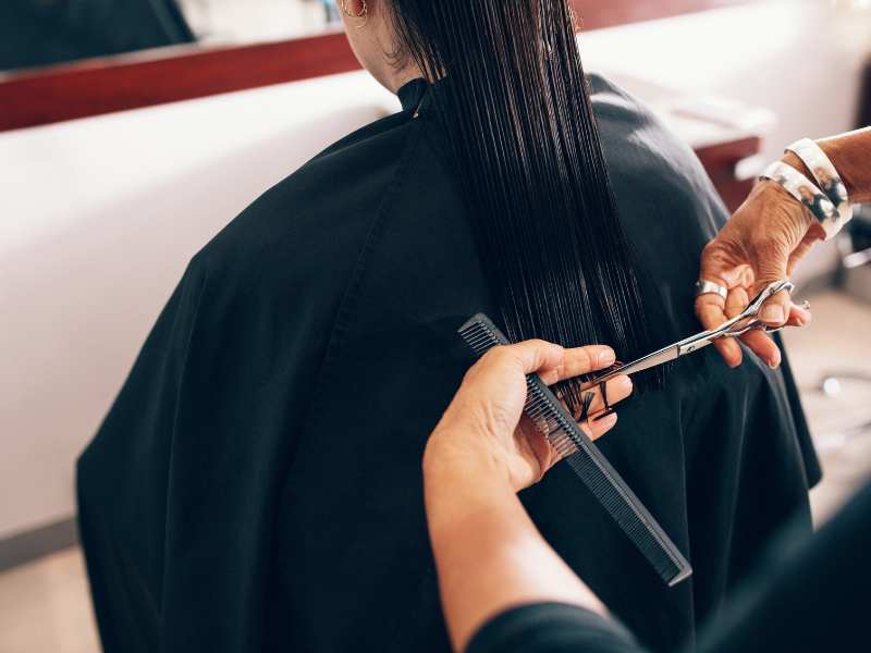 woman-trimming-her-hair-to-keep-it-healthy