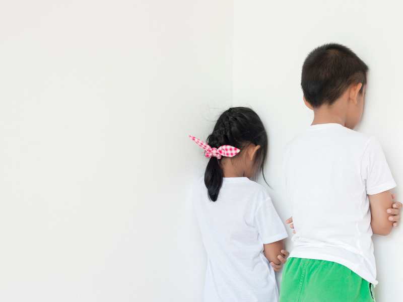 boy-and-girl-standing-facing-the-wall-as-a-means-of-discipline-without-destroying-their-self-esteem