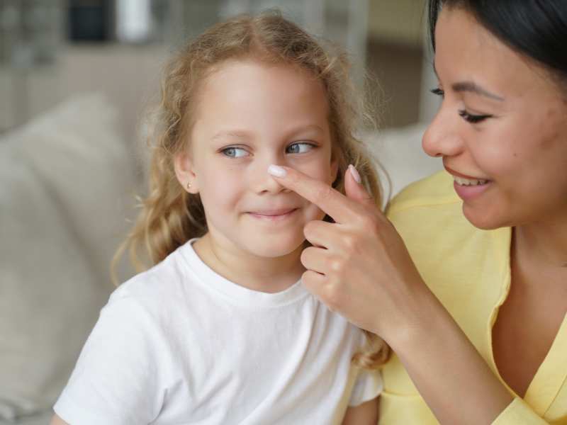 smiling-mom-shows-love-to-little-special-child