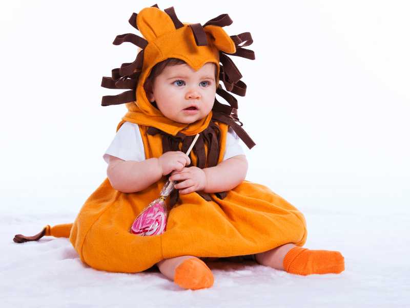 baby-putting-on-adorable-baby-first-Halloween-costume-idea