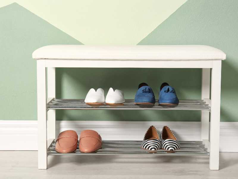 a-white-bench-with-storage-system