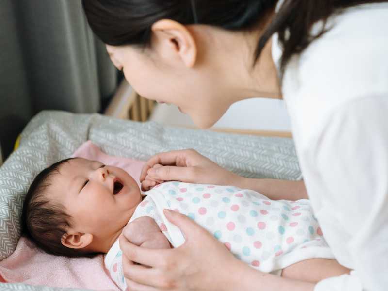 mom-with-happy-baby-after-a-diaper-change