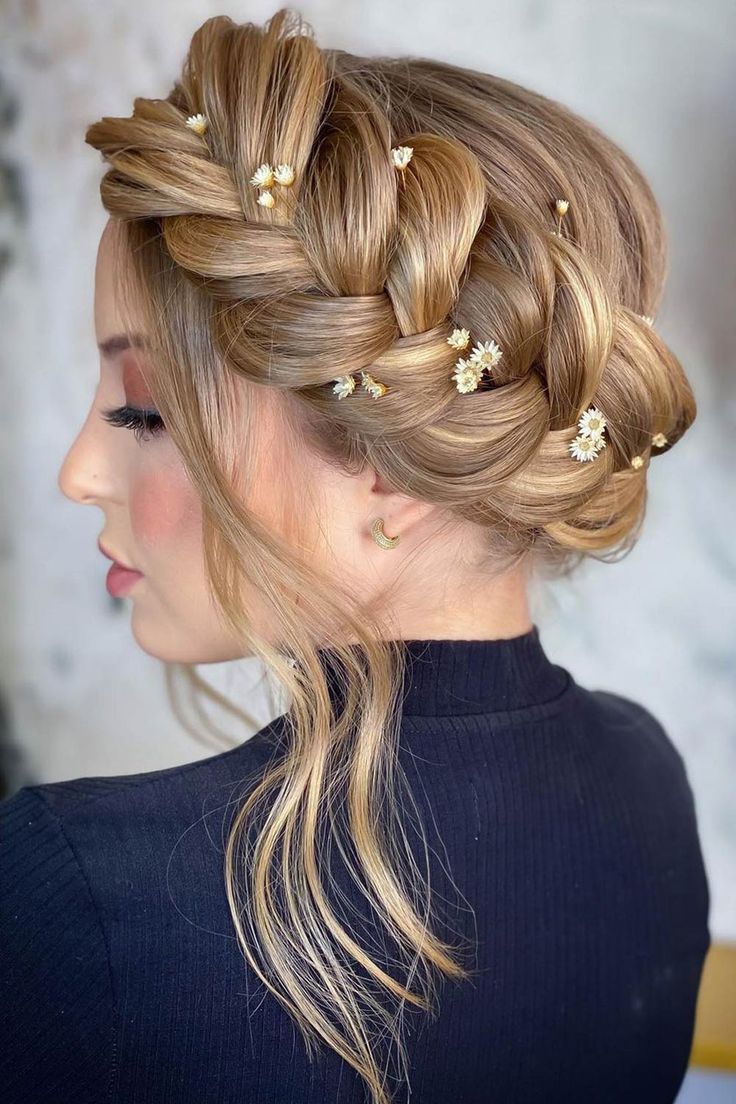 a-woman-with-blond-hair-wearing-a-crown-braided-hairstyle