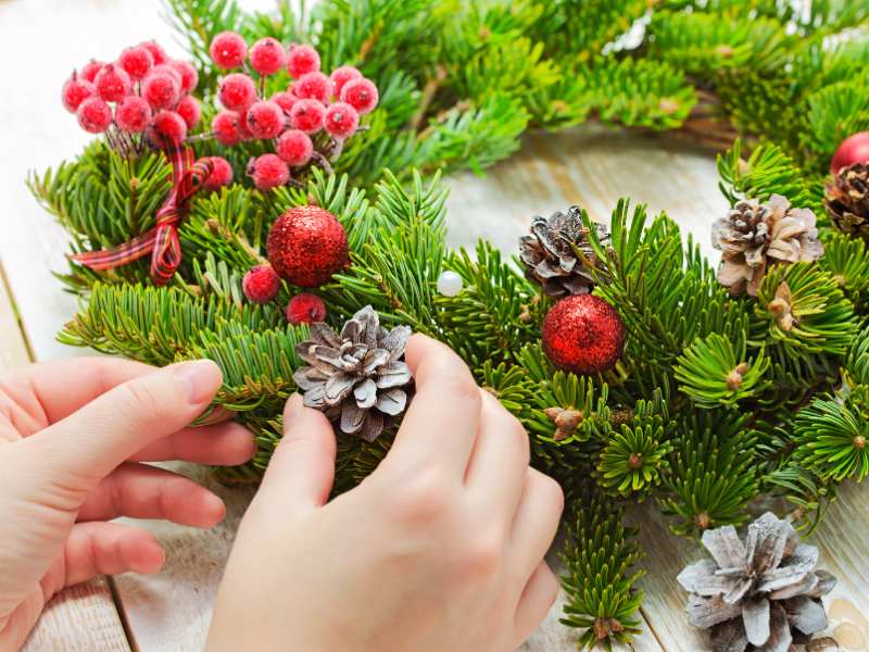 a-woman-making-a-Christmas-tree-