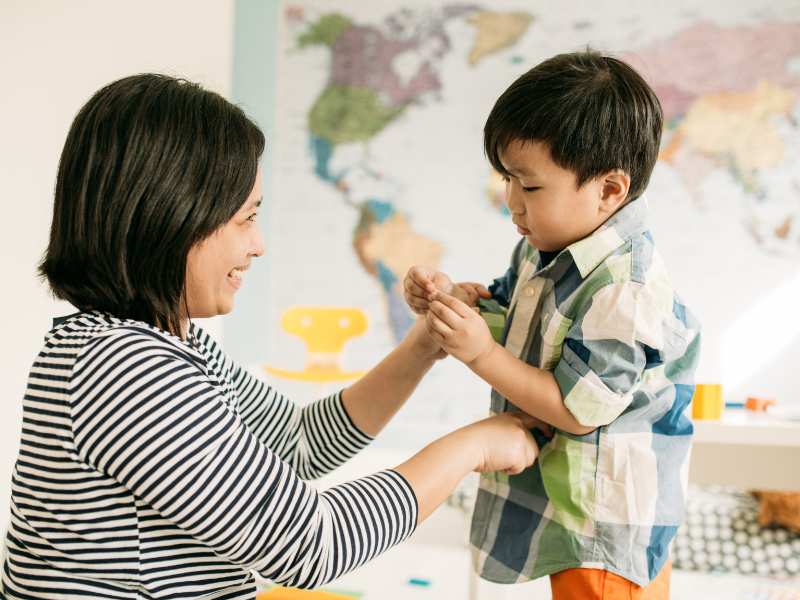 little-child-with-mom-playing-dress-up