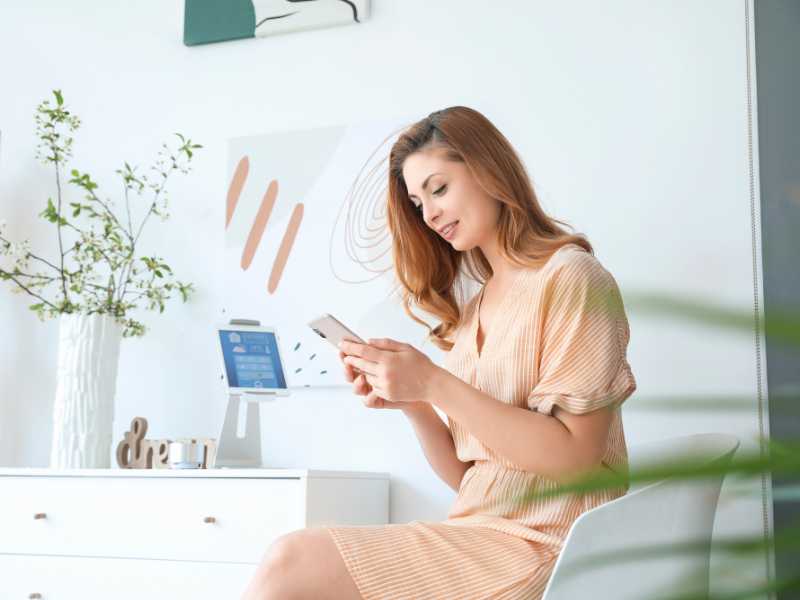 woman-using-application-of-smart-home-application