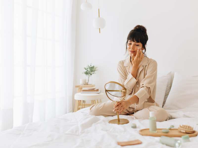 woman-on-bed-taking-care-of-herself