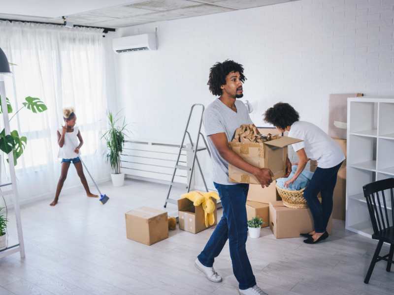 woman-with-kids-cleaning-and-packing-stuffs