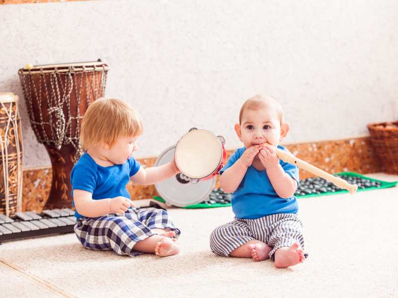 two-little-boys-playing-with-musical-instruments