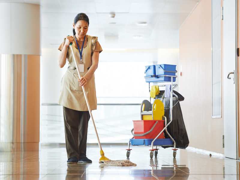 woman-with-a-mop-and-cleaning-supplies