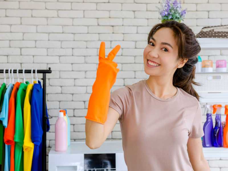 woman-with-orange-color-cleaning-gloves