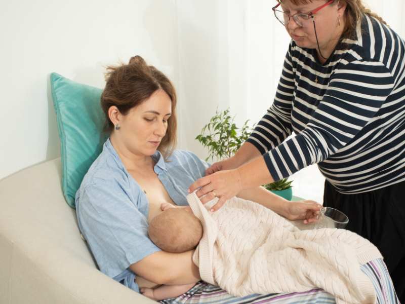 mom-trying-to-breastfeed-new-born