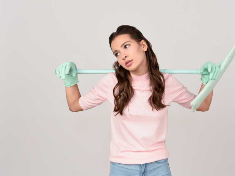 woman-with-cleaning-mop-on-shoulders