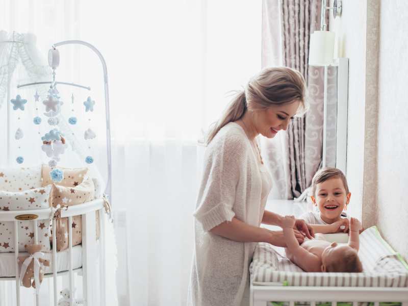 woman-on-white-with-baby-and-a-older-child