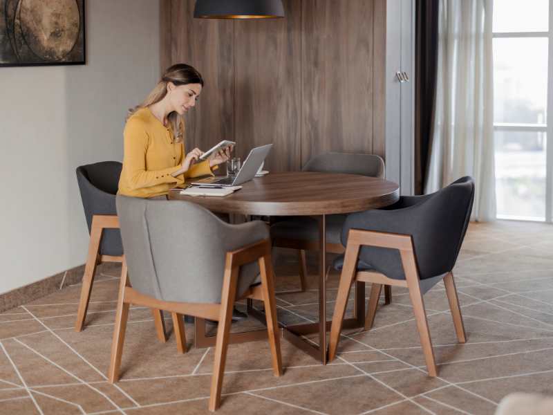 woman-working-with-laptop-in-a-room