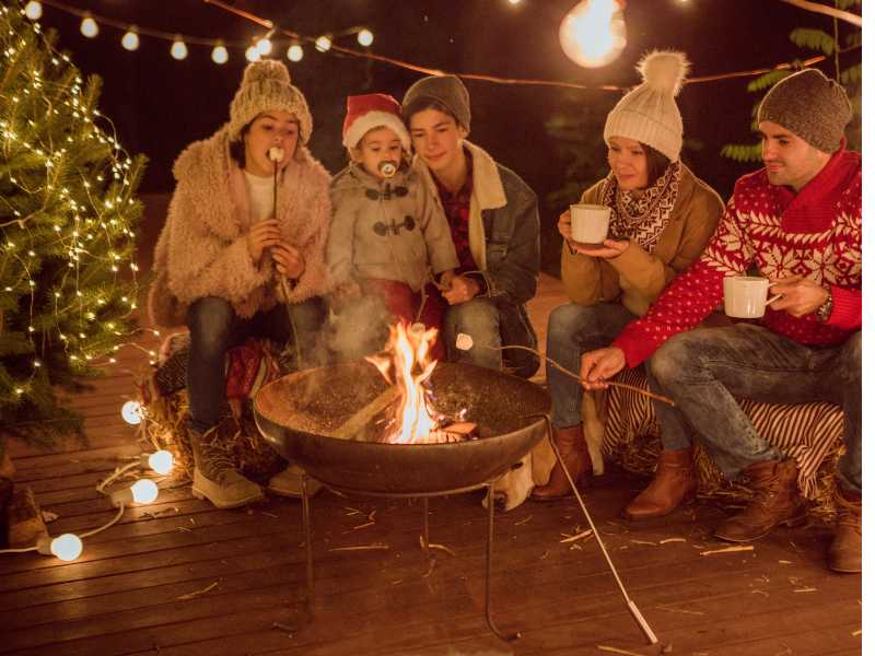 a-family-in-a-camp-fire-outside-for-the-holiday