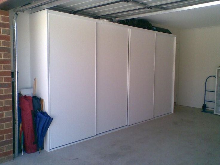 a-white-sliding-storage-door-for-optimizing-space-in-your-home