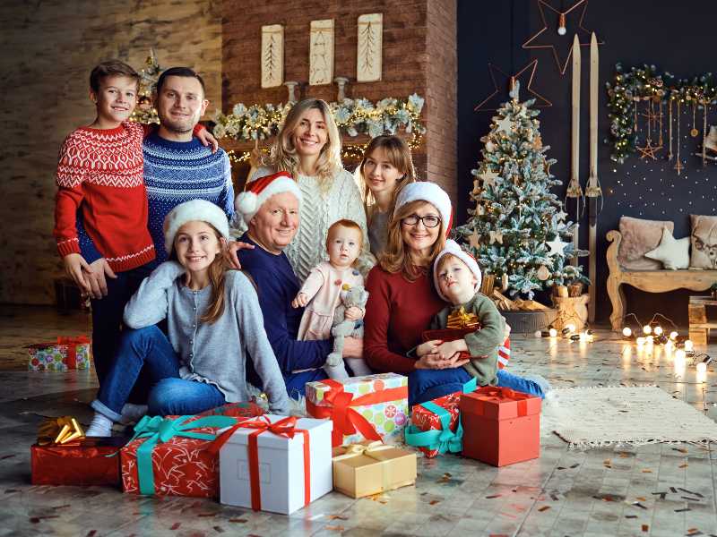 a-family-portrait-with-a-Christmas-tree-behind