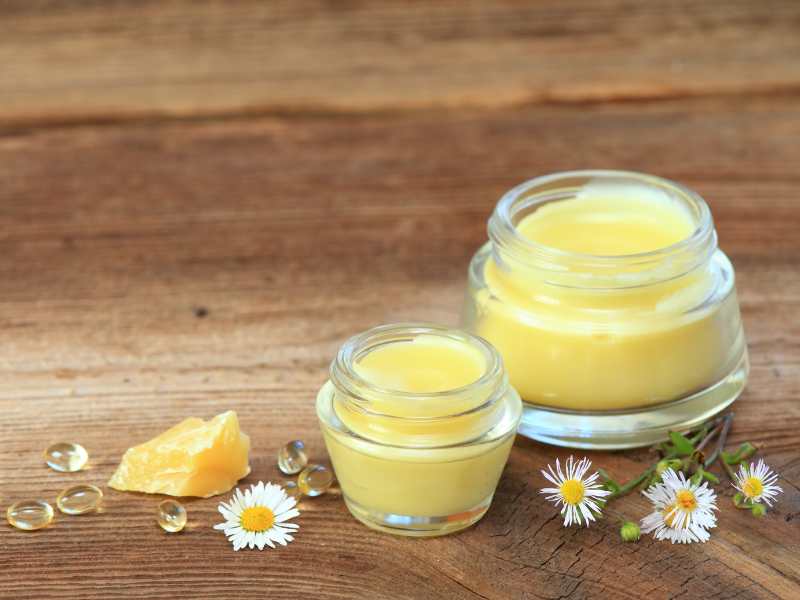 a-homemade-lip-balm-on-brown-table