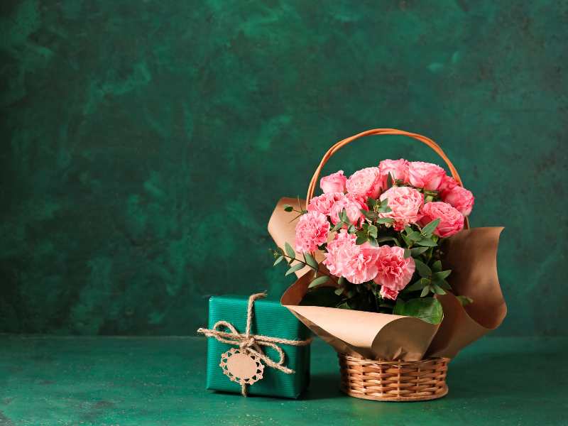 a-pink-flower-on-a-small-basket-for-mothers-as-Christmas-gift