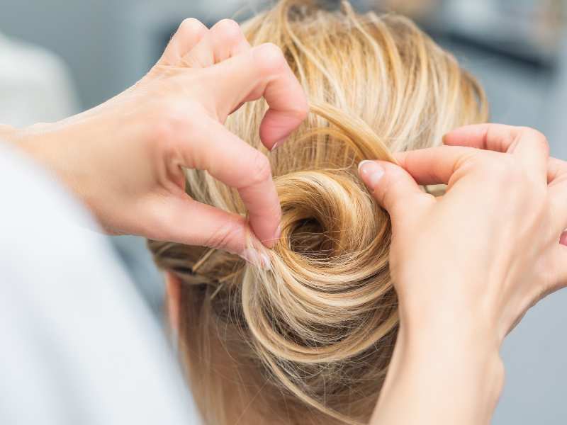 hand-making-a-bun-hairstyle