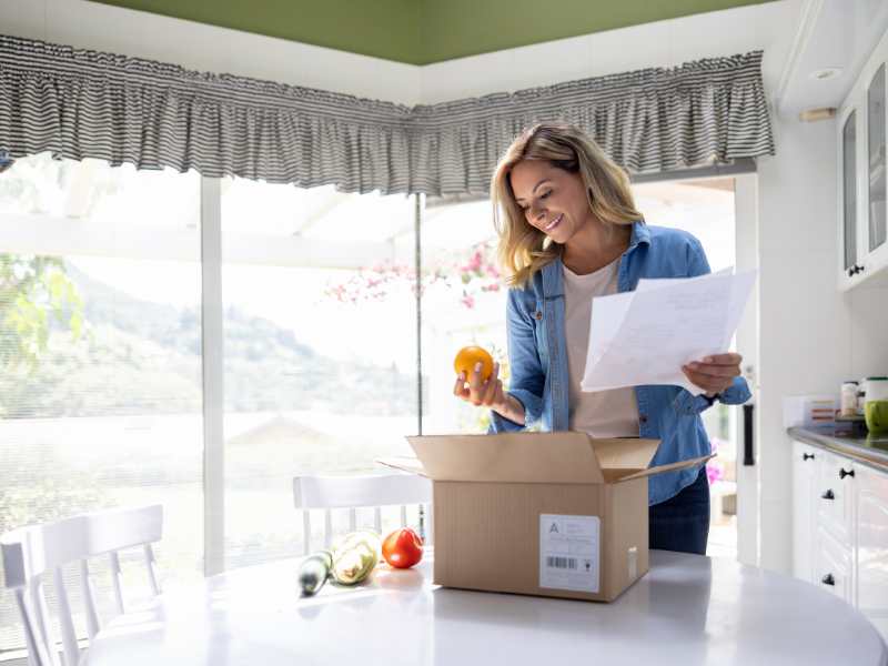 woman-bringing-out-snacks-from-a-box