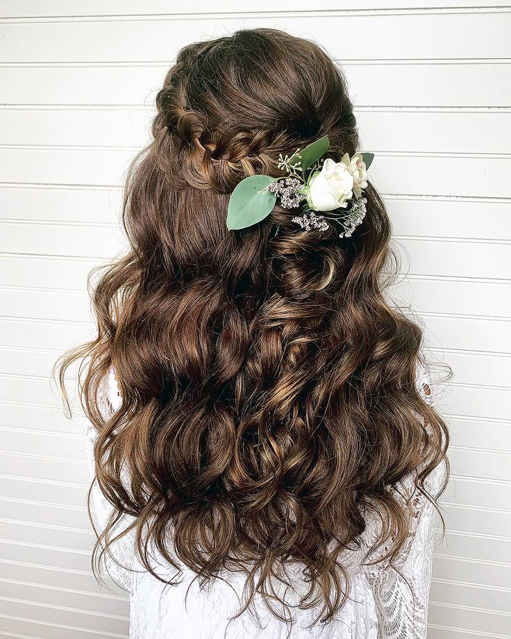 little-girl-with-curly-half-up-brown-hair-with-flower-clip