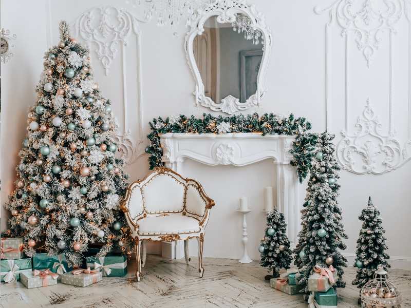 a-beautiful-white-background-with-a-big-Christmas-tree-and-three-other-small-ones