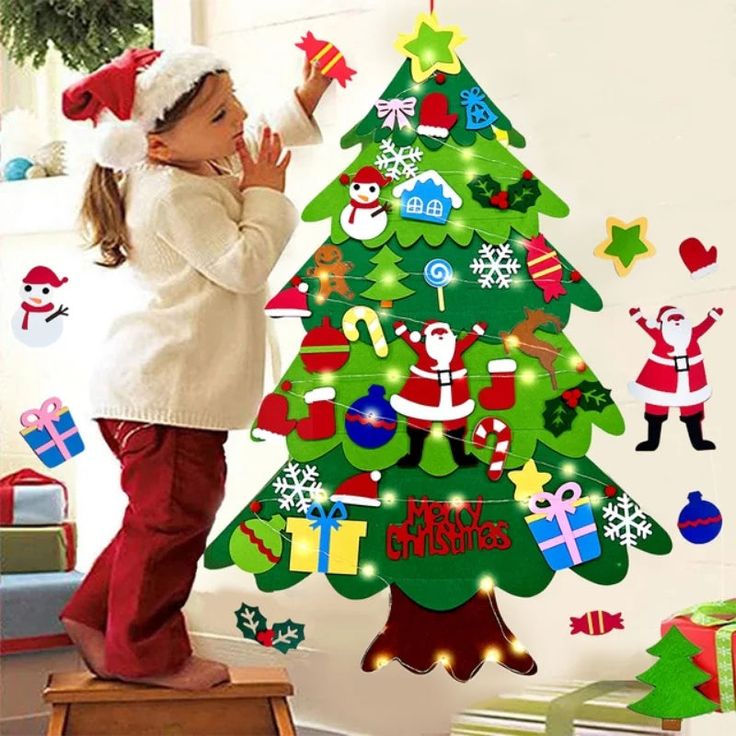 little-boy-standing-by-a-felt-Christmas-tree