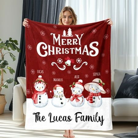 a-woman-showing-off-a-Christmas-personalized-blanket