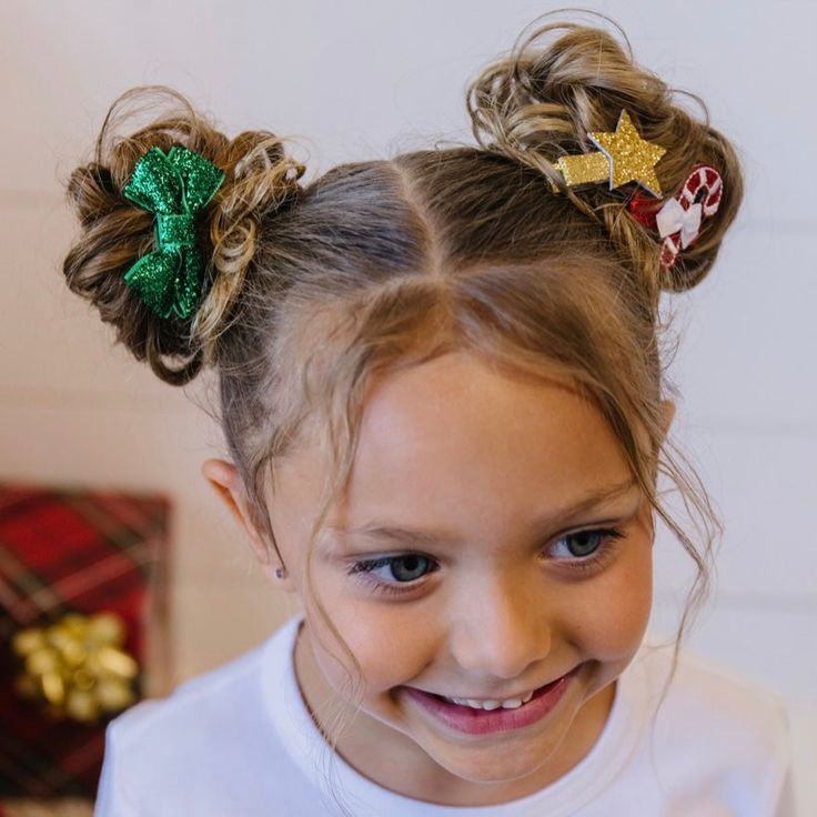 little-girl-with-pigtail-buns-hairstyle-for kids-with-Christmas-clips