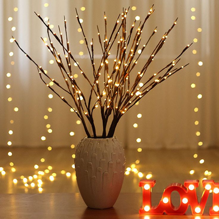 twigs-branches-in-a-vase-with-gold-lightening