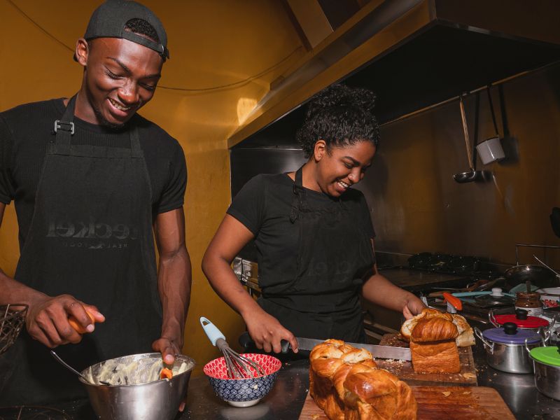 man-and-woman-on-black-cooking