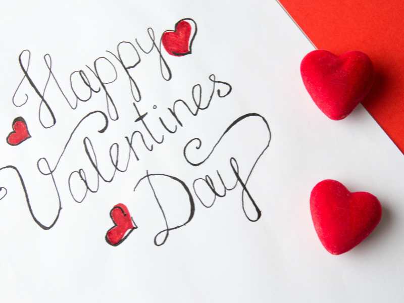 white-paper-with-red-heart-shape-with-happy-valentine's-day-written