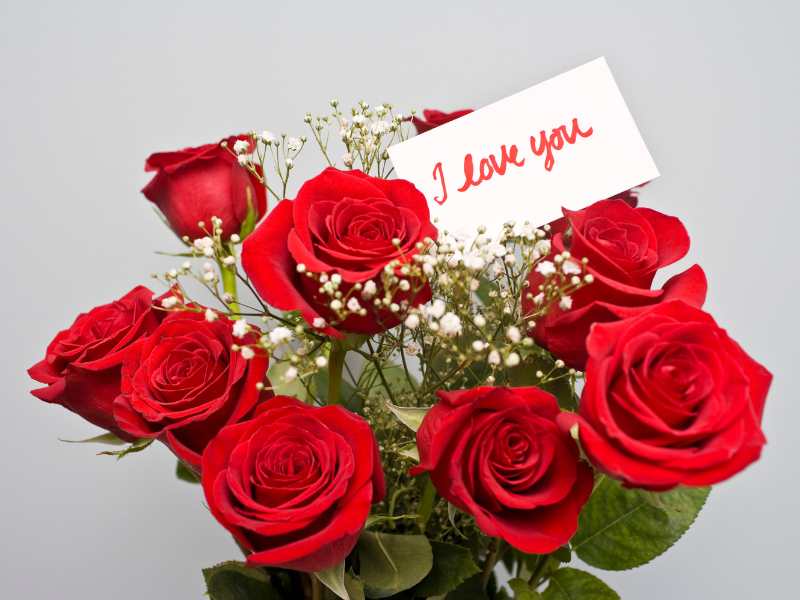 white-envelope-on-red-flowers